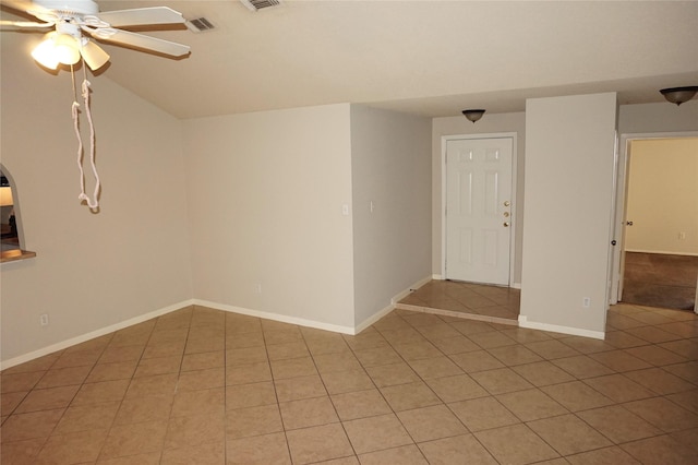 spare room with light tile patterned floors and ceiling fan