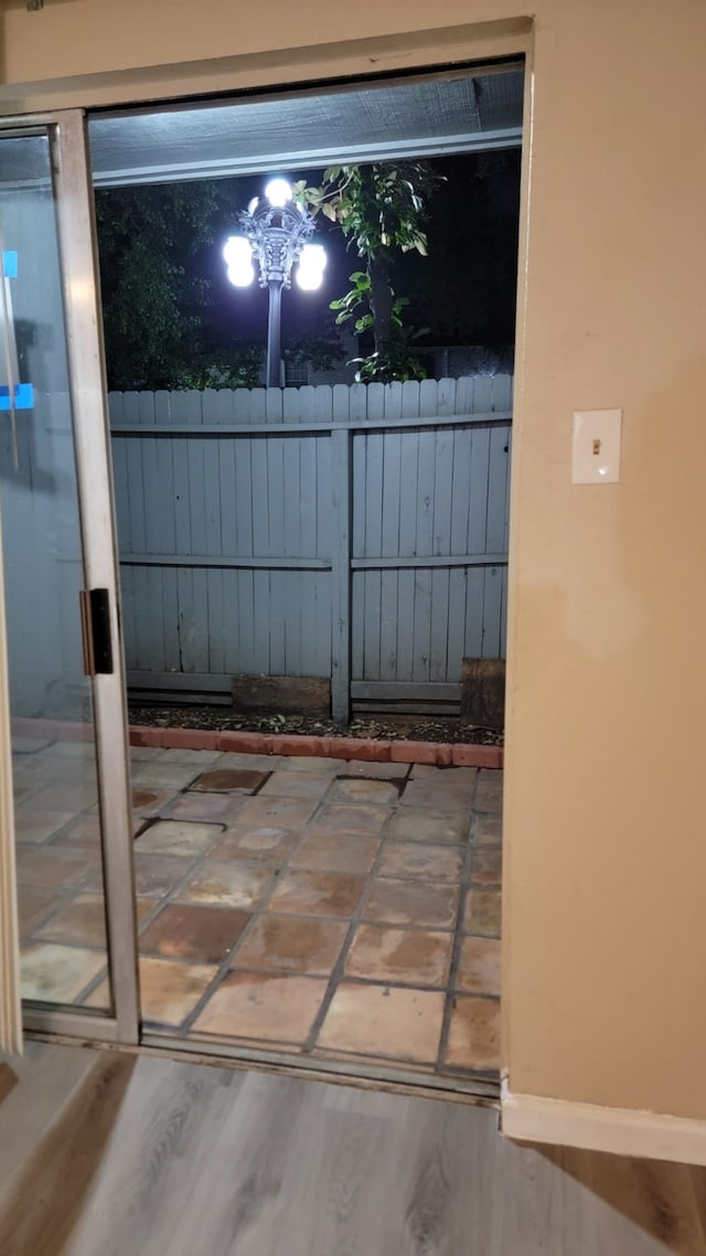 doorway to outside with hardwood / wood-style flooring