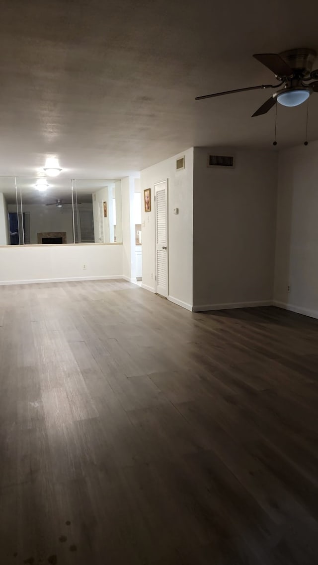 unfurnished room featuring wood-type flooring and ceiling fan