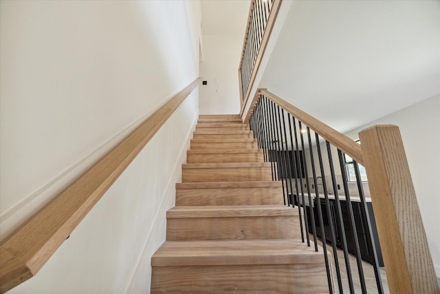 stairs with hardwood / wood-style flooring