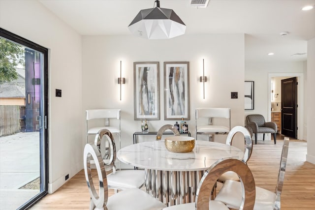 dining space featuring light hardwood / wood-style flooring