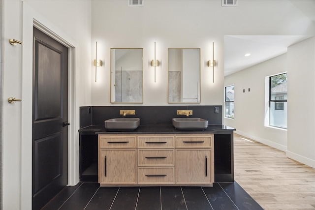 bathroom with vanity and hardwood / wood-style floors