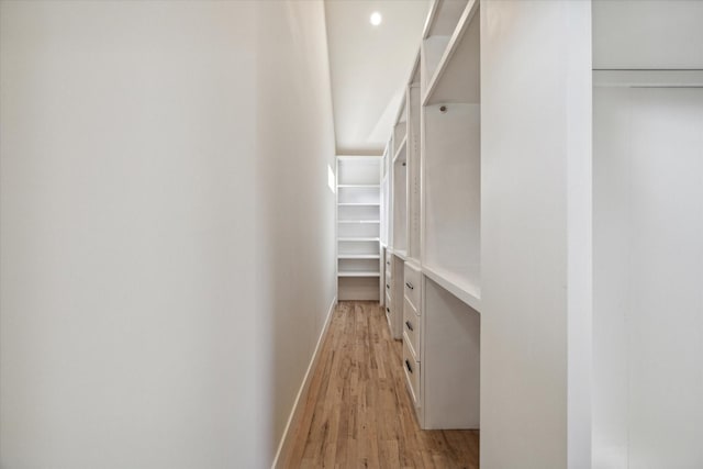 walk in closet featuring light hardwood / wood-style floors