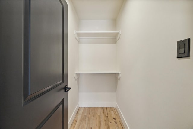 walk in closet featuring light hardwood / wood-style floors