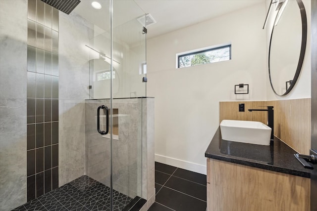 bathroom with vanity, tile patterned floors, and walk in shower