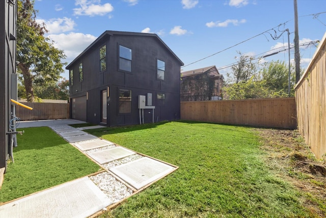 rear view of house featuring a yard