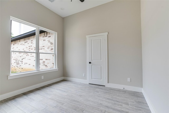 1037 Rd 6609, Dayton, TX 77535 - spare room featuring baseboards, ceiling fan, and light wood-type flooring