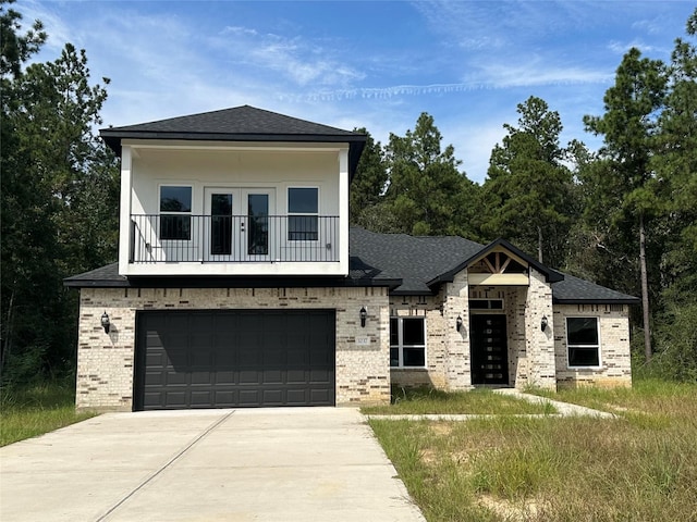 1037 Rd 6609, Dayton, TX 77535 - view of front of home featuring brick siding, a garage, a balcony, concrete driveway, and a shingled roof