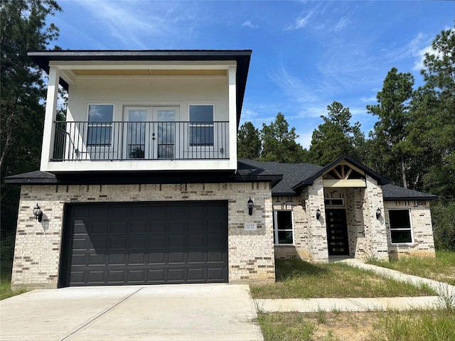 1037 Rd 6609, Dayton, TX 77535 - view of front of house featuring brick siding, a balcony, concrete driveway, a garage, and french doors