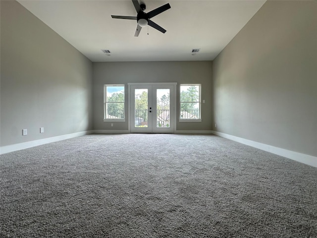 1037 Rd 6609, Dayton, TX 77535 - spare room featuring ceiling fan, french doors, carpet flooring, and baseboards