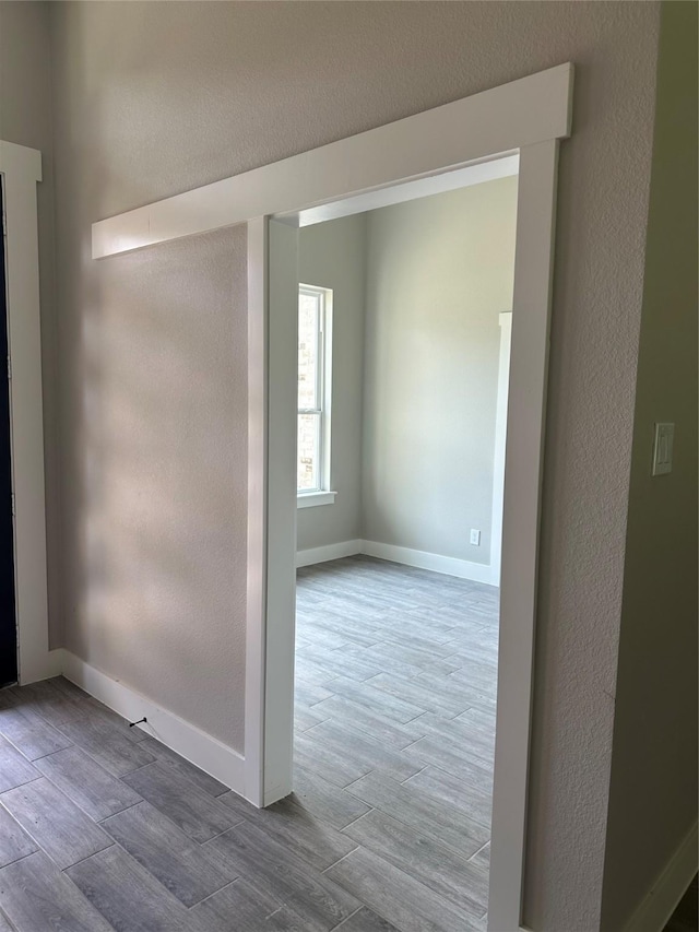 unfurnished room with hardwood / wood-style flooring