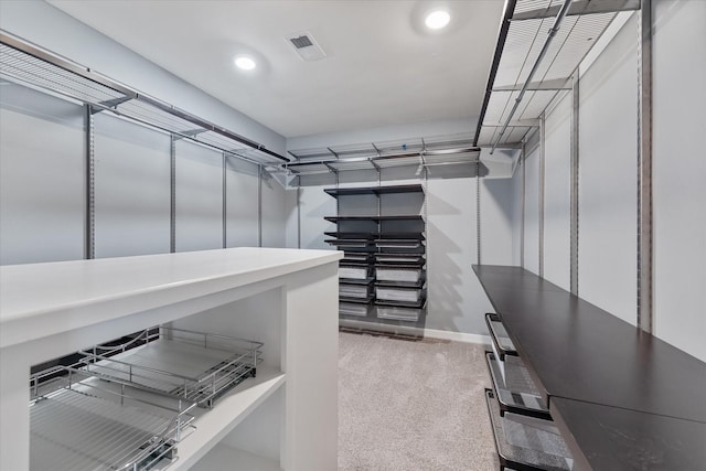 walk in closet featuring carpet floors and visible vents