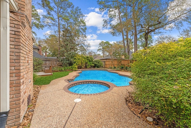 view of pool featuring a fenced in pool, a fenced backyard, and a patio