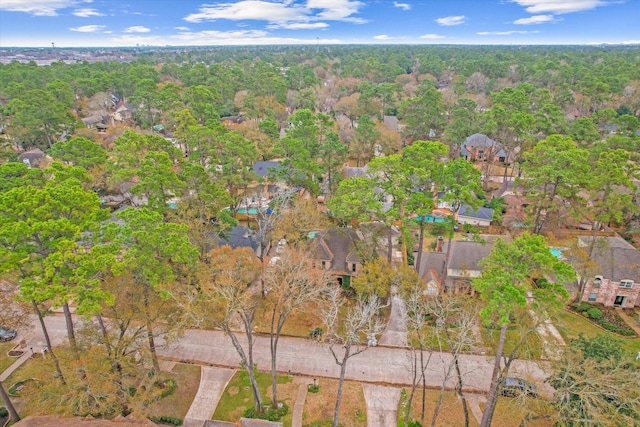 aerial view featuring a wooded view