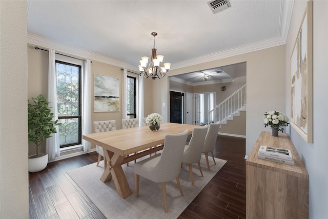 dining room featuring visible vents, baseboards, ornamental molding, stairway, and dark wood-style floors