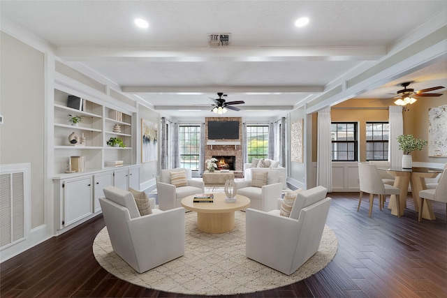 living area with dark wood-style floors, beam ceiling, visible vents, and a fireplace