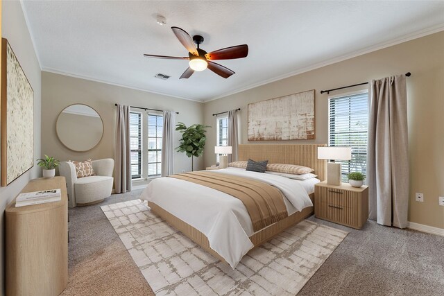 bedroom featuring crown molding, ceiling fan, and light carpet