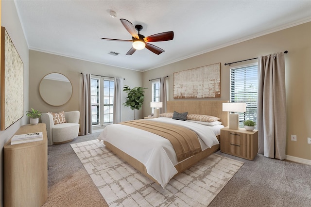 bedroom with light carpet, visible vents, and ornamental molding