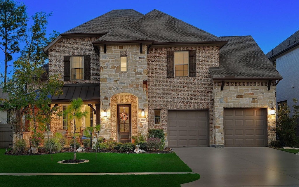 french country style house with a garage and a yard