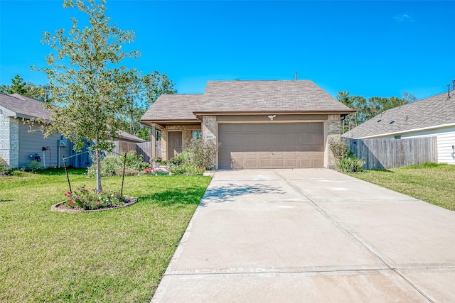 view of front of home featuring a garage and a front lawn