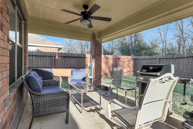 view of patio with an outdoor living space and ceiling fan