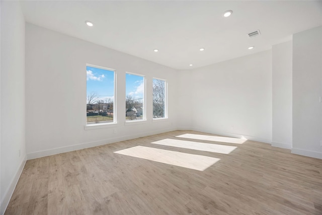 unfurnished room featuring light hardwood / wood-style flooring