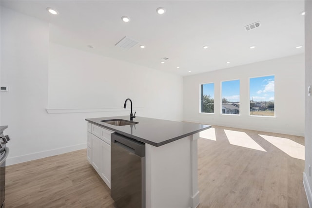 kitchen with sink, dishwasher, a kitchen island with sink, white cabinets, and light wood-type flooring