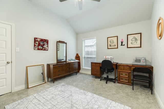 carpeted office with lofted ceiling and ceiling fan