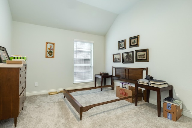 sitting room with light colored carpet and lofted ceiling