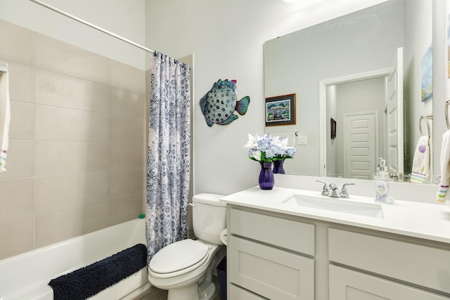 full bathroom featuring shower / tub combo, vanity, and toilet