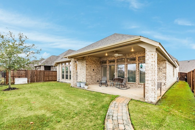 back of house with a patio, a yard, and ceiling fan