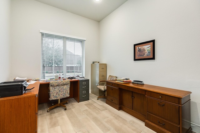 office space with light hardwood / wood-style flooring