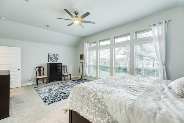 bedroom featuring ceiling fan, lofted ceiling, and light carpet