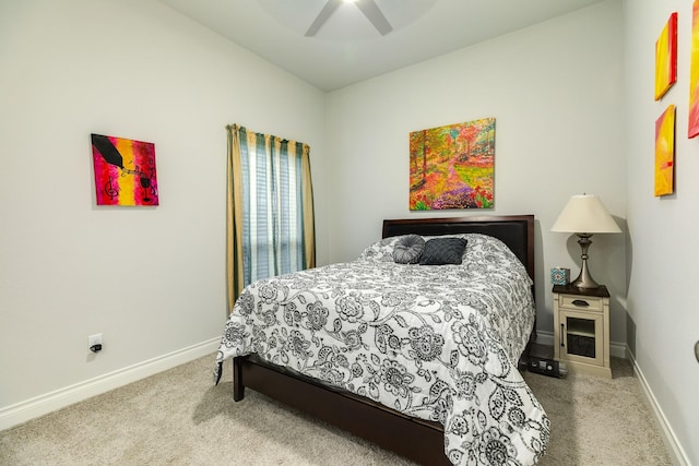 bedroom featuring light colored carpet and ceiling fan