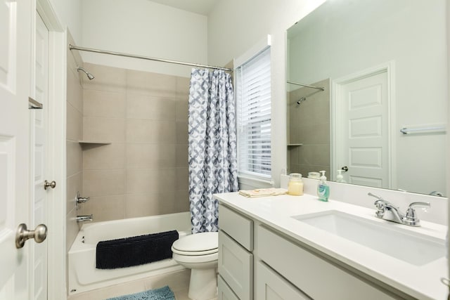 full bathroom with vanity, shower / bath combination with curtain, and toilet