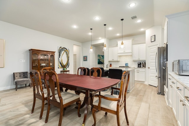 dining room featuring light wood-type flooring