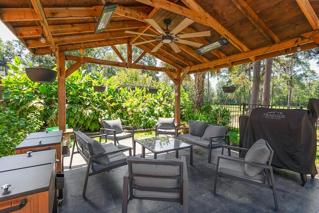 view of patio with an outdoor living space, a gazebo, grilling area, and ceiling fan