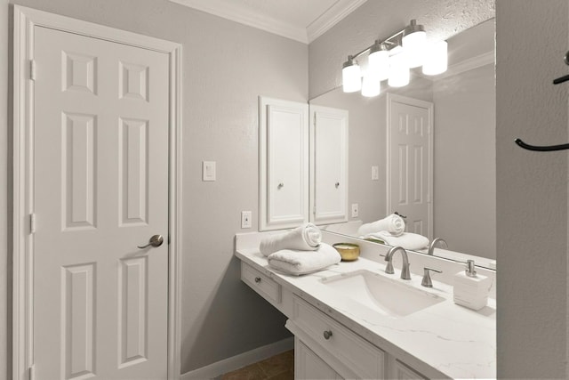 bathroom with tile patterned flooring, ornamental molding, and vanity