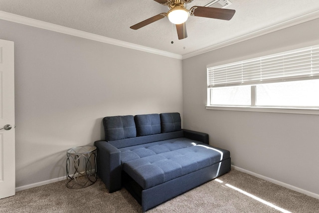 living area featuring ornamental molding, carpet floors, and a textured ceiling