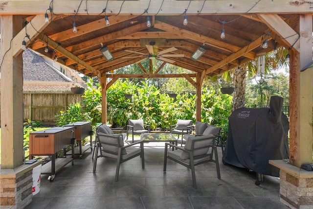 view of patio featuring a gazebo, ceiling fan, and area for grilling