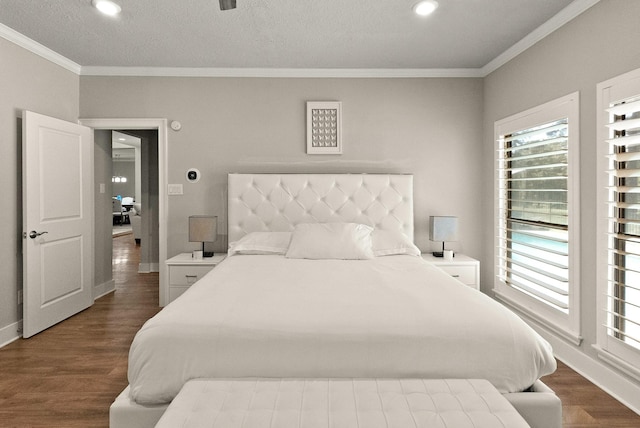 bedroom featuring crown molding, dark hardwood / wood-style floors, and a textured ceiling