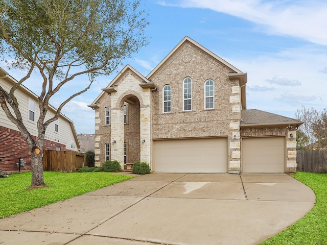 view of front of house featuring a garage and a front yard