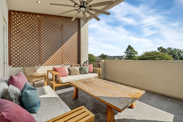 view of patio with outdoor lounge area and ceiling fan