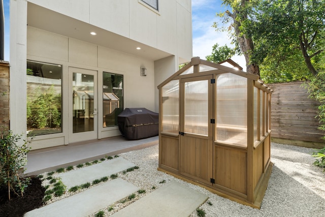 exterior space with grilling area and an outdoor structure