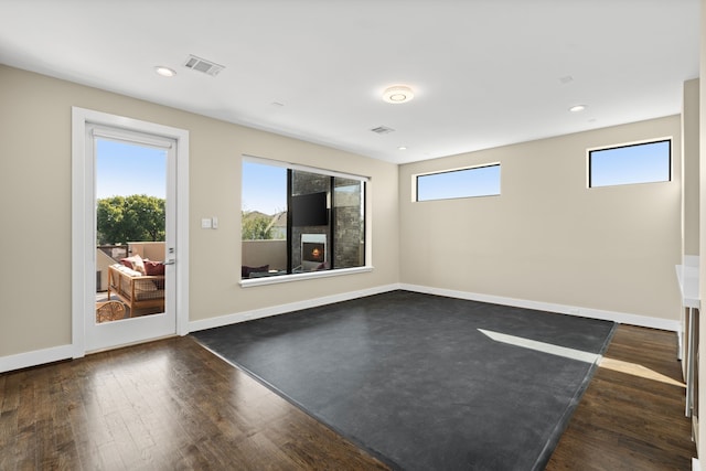 spare room with dark hardwood / wood-style floors