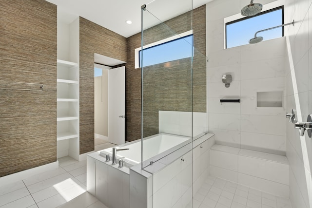 bathroom featuring plus walk in shower and tile patterned flooring