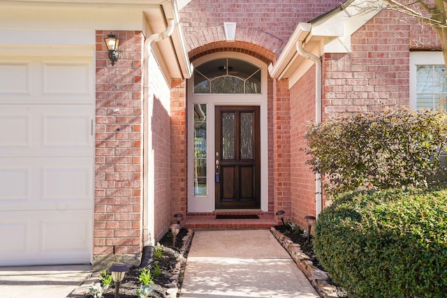 entrance to property featuring a garage