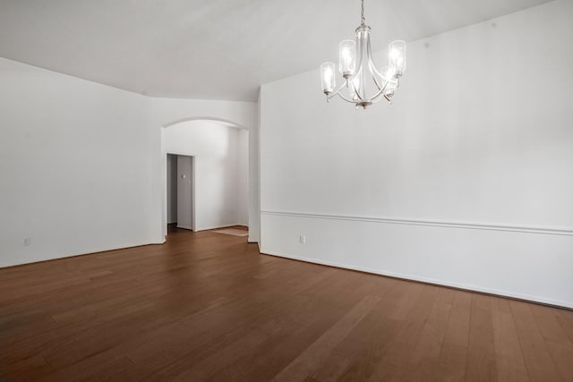 unfurnished room with dark hardwood / wood-style flooring