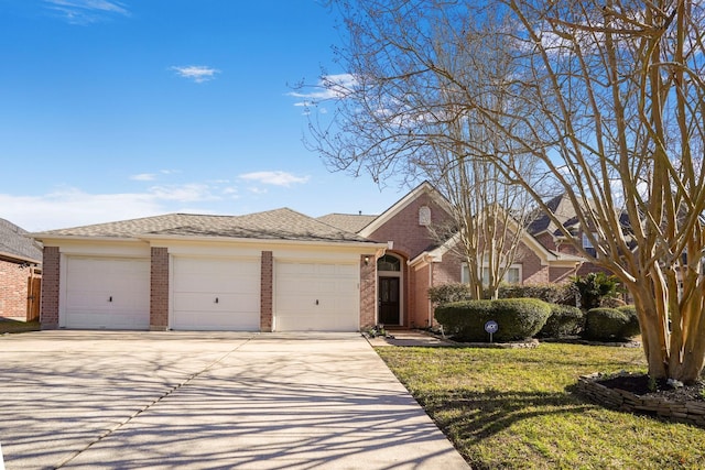 view of front of property featuring a garage and a front lawn