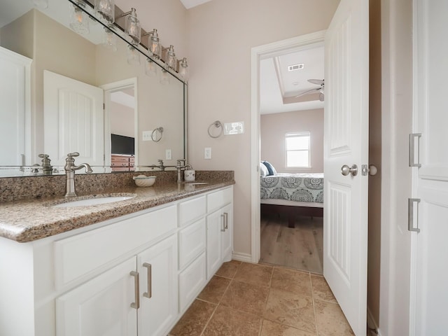 bathroom with vanity and ceiling fan